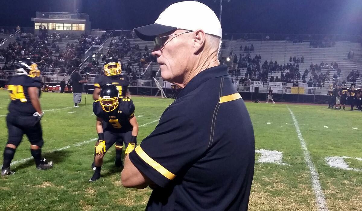 San Pedro Coach Michael Walsh watches his team warm up for the Marine League showdown against Carson on Friday night.