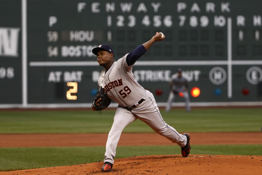 Houston Astros starting pitcher Framber Valdez delivers against the Boston Red Sox during the first inning of a baseball game Tuesday, June 8, 2021, at Fenway Park in Boston. (AP Photo/Winslow Townson)