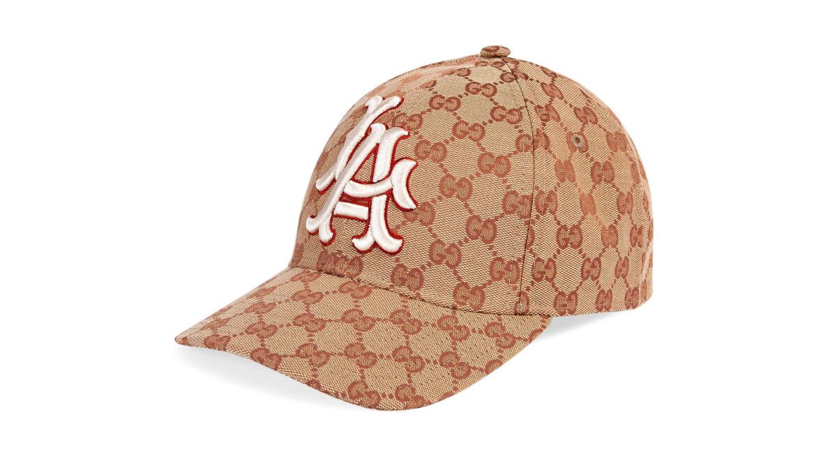 Gucci canvas logo baseball hat with LA Angels patch, $530 at Gucci boutiques in Beverly Hills and at the Beverly Center in Los Angeles, gucci.com.