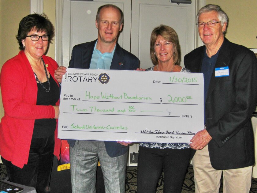 Hope Without Boundaries President Lesley Sagar and CFO Paul Sagar (on right) accept the $2,000 donation from Del Mar-Solana Beach Rotary President Diane Huckabee and International Service Director Ken Barrett (on left). Courtesy photo