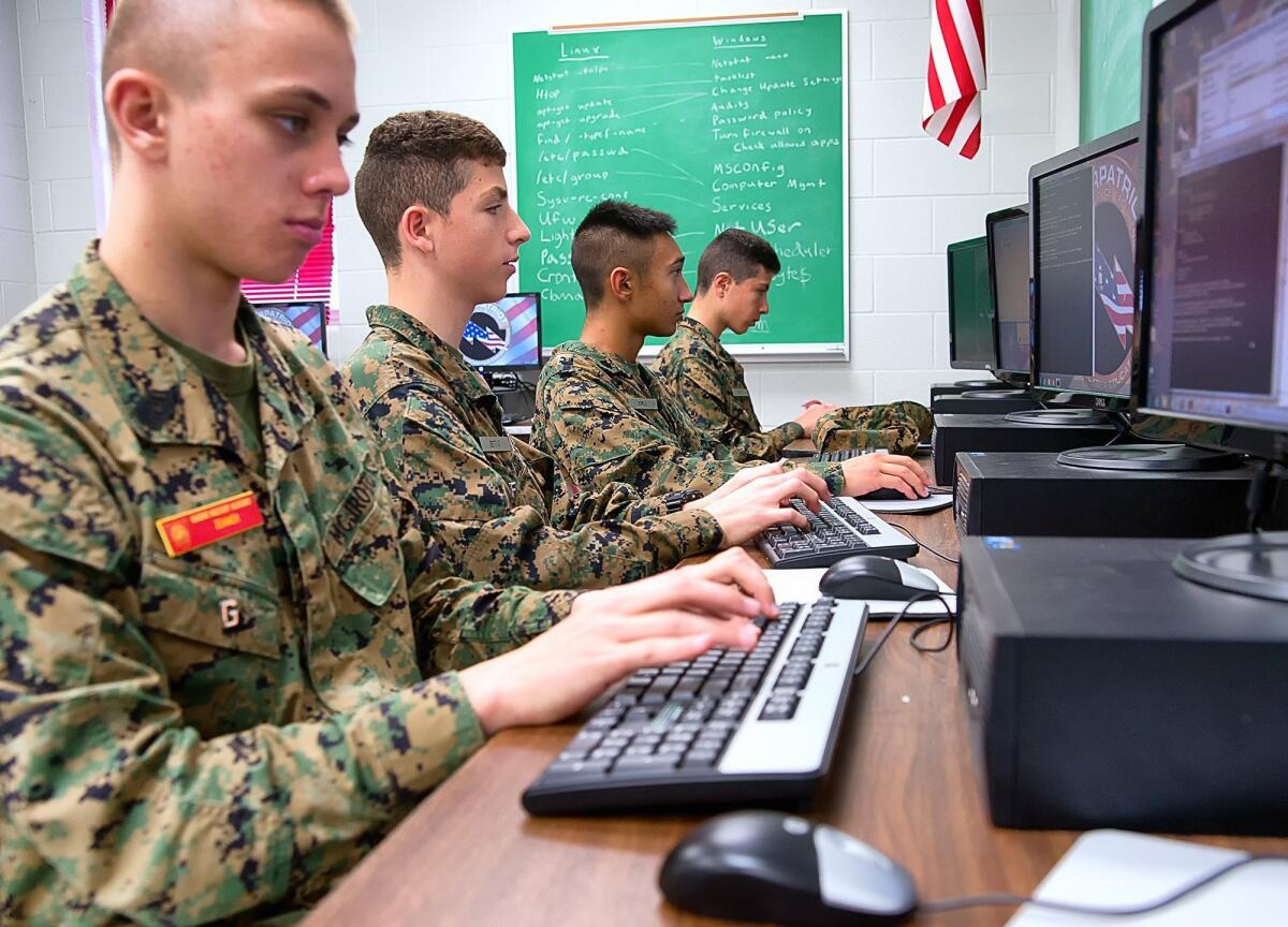 The Marine Military Academy CyberPatriot team practices their security skills before a competition that took place in Harlingen, Texas, in March.