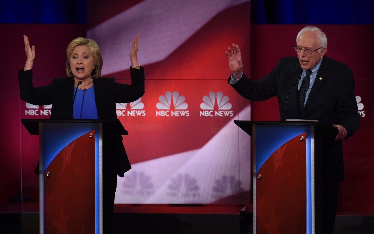 Democratic presidential candidates Hillary Clinton and Bernie Sanders debate in Charleston, S.C., on Jan. 17.