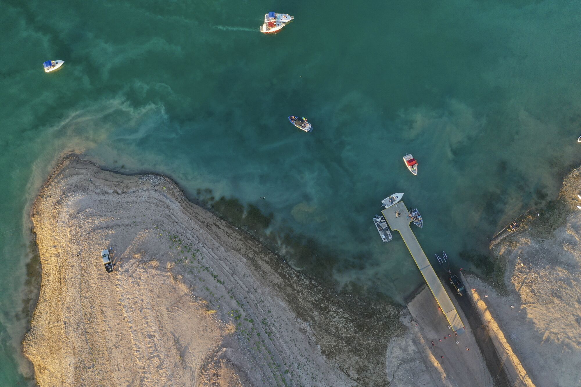 An aerial view of a boat launch ramp on the lake