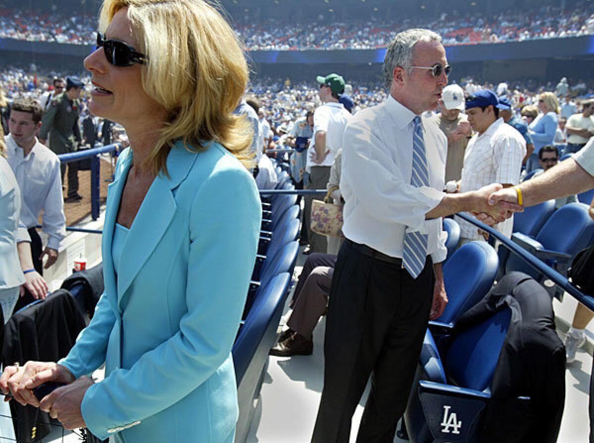 Frank and Jamie McCourt take in opening day at Dodger Stadium in 2006.