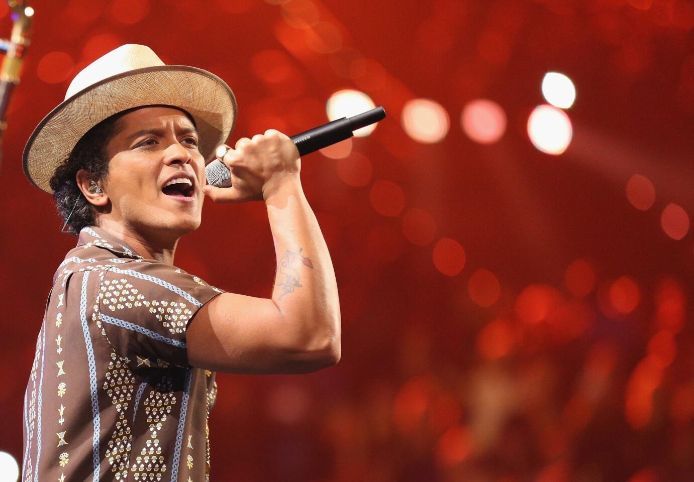Singer Bruno Mars, shown performing during the iHeartRadio Music Festival at the MGM Grand in Las Vegas in September, is among the 2014 Headwear Hall of Fame inductees.