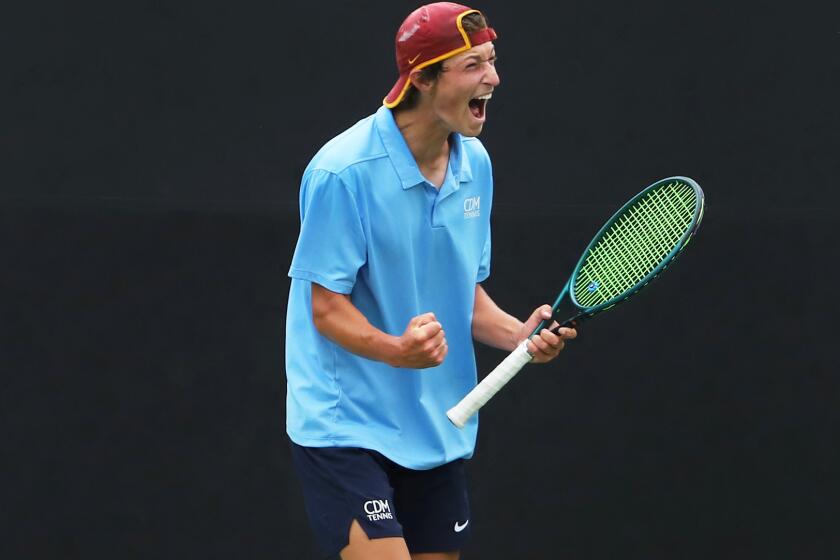 Corona del Mar High School's top-seeded tennis player Niels Hoffmann celebrates.