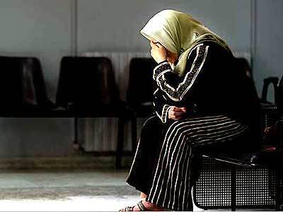 Hamdi Abu Amir, 34, takes refuge at the Al-Razi Hospital in Jenin. She and her family were expelled from their home in the Jenin refugee camp. She sits in the lobby while the city remains under a 24-hour curfew.