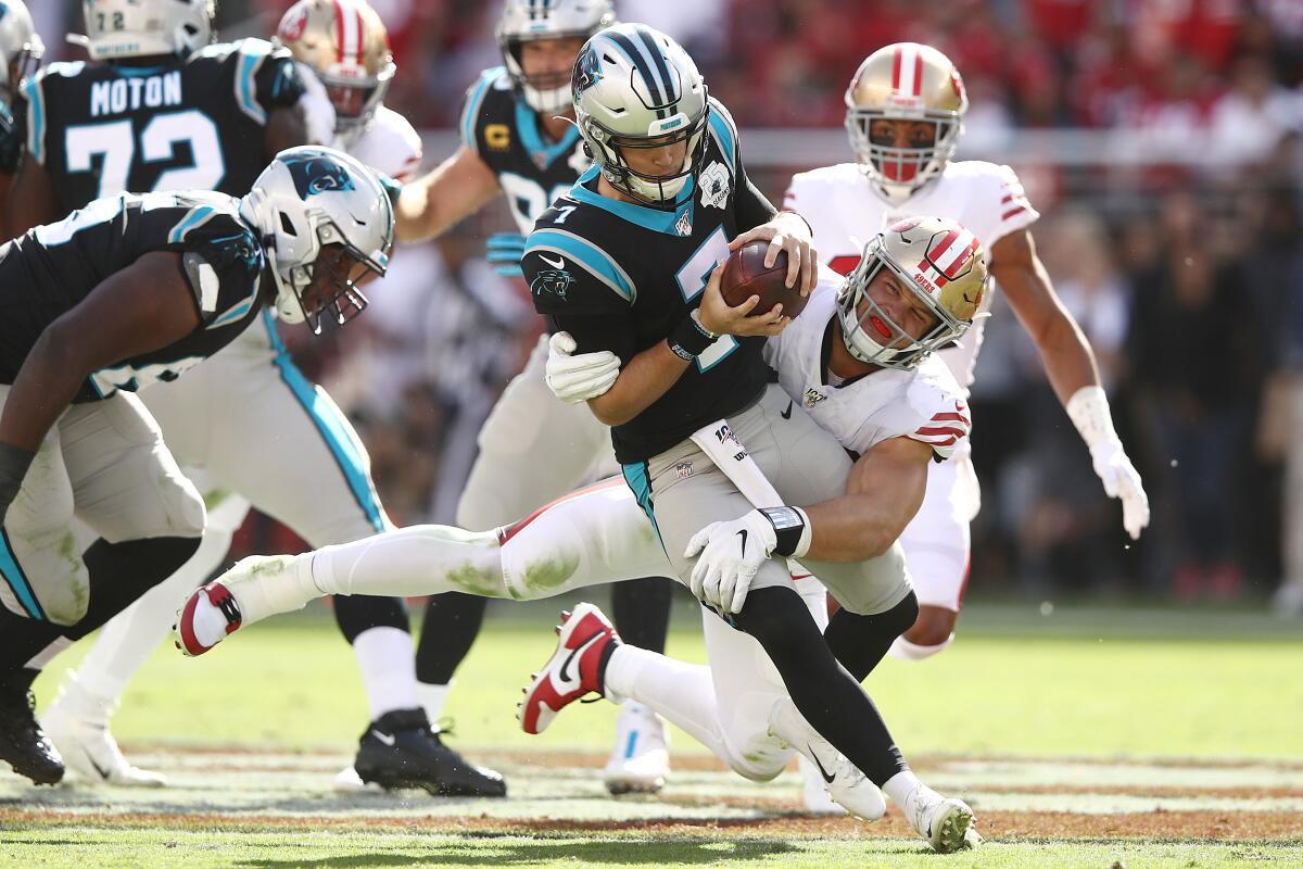 San Francisco 49ers defensive end Nick Bosa sacks Carolina Panthers quarterback Kyle Allen during the second quarter Sunday.