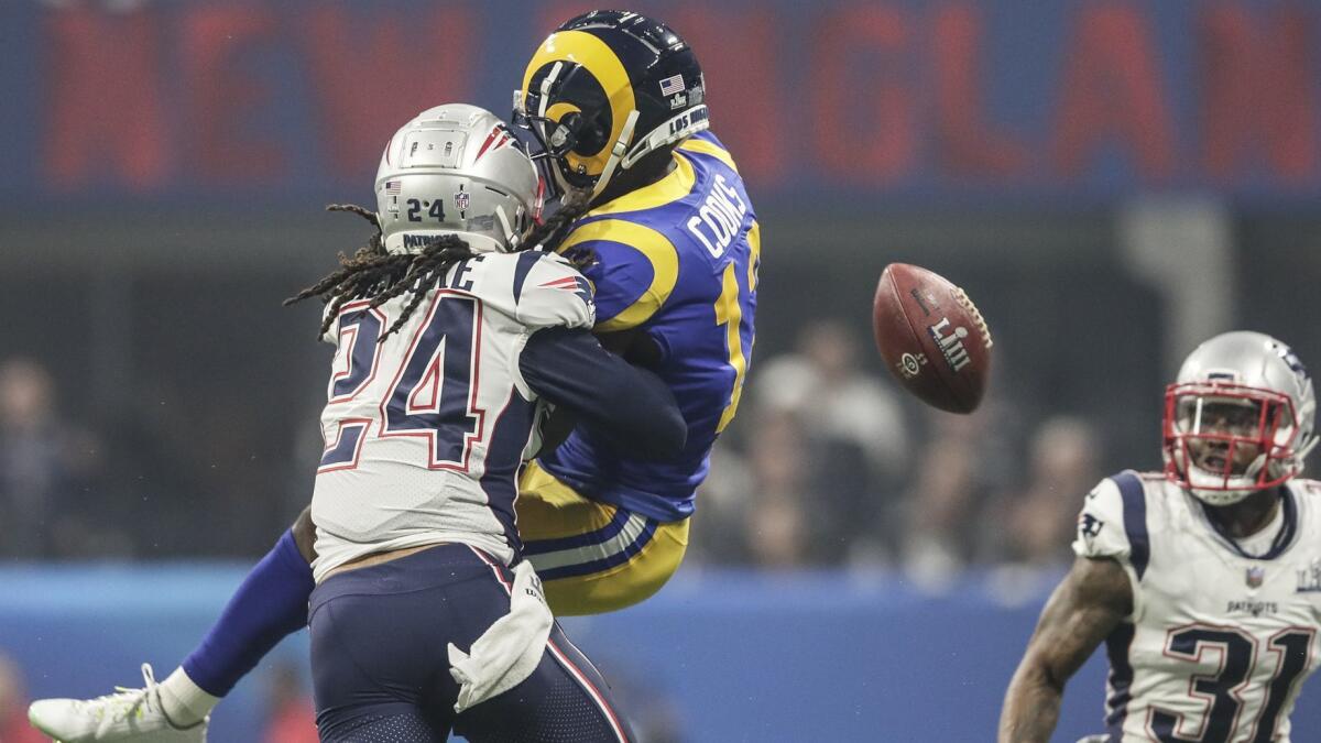 Patriots defensive back Stephon Gilmore prevents Rams receiver Brandin Cooks from making a catch during the third quarter.
