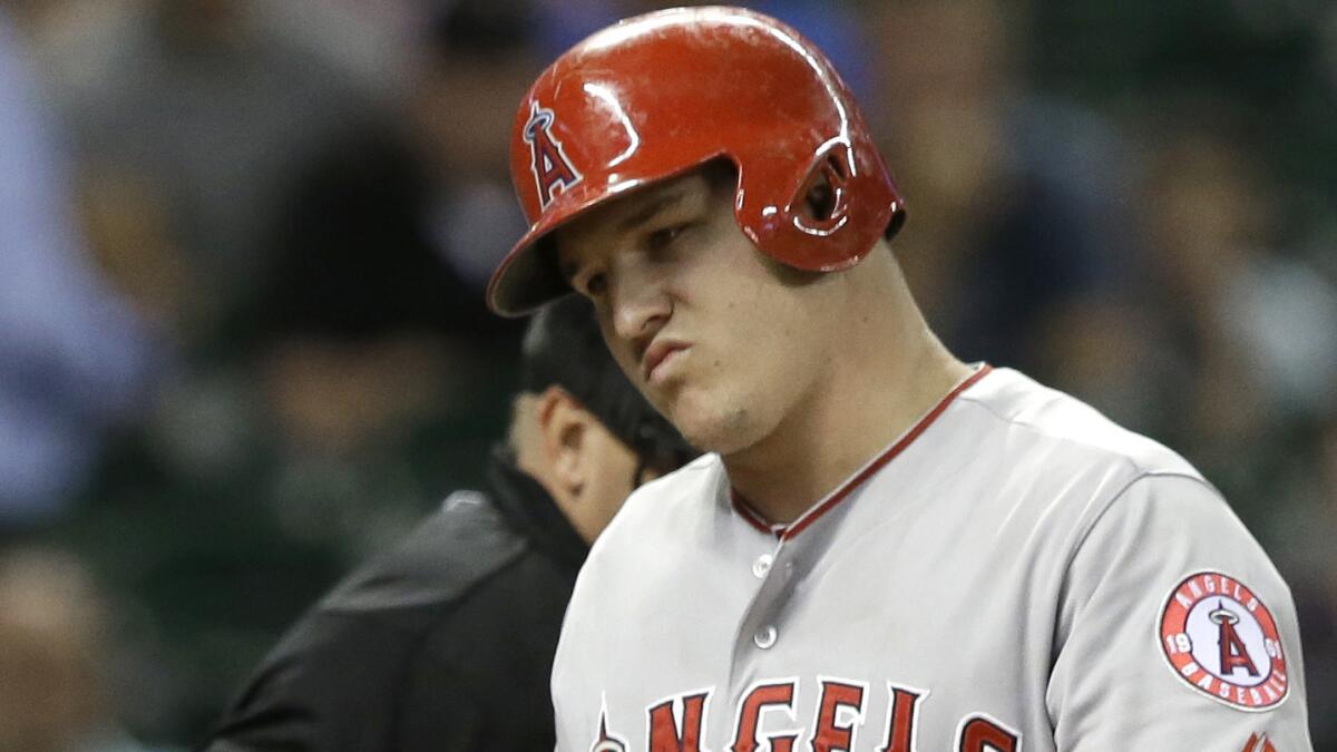 Angels center fielder Mike Trout reacts after striking out during the eighth inning of a 4-1 loss to the Houston Astros on Wednesday.