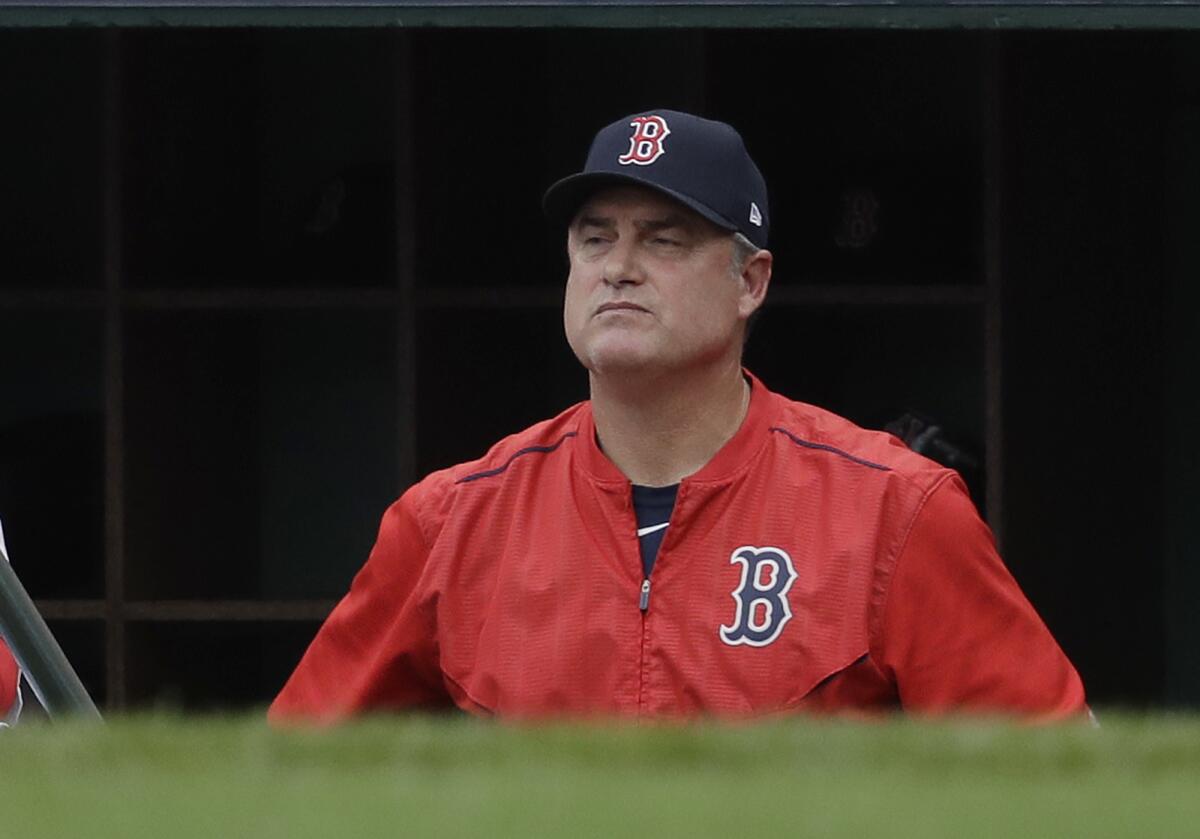 John Farrell watches a game from the dugout.