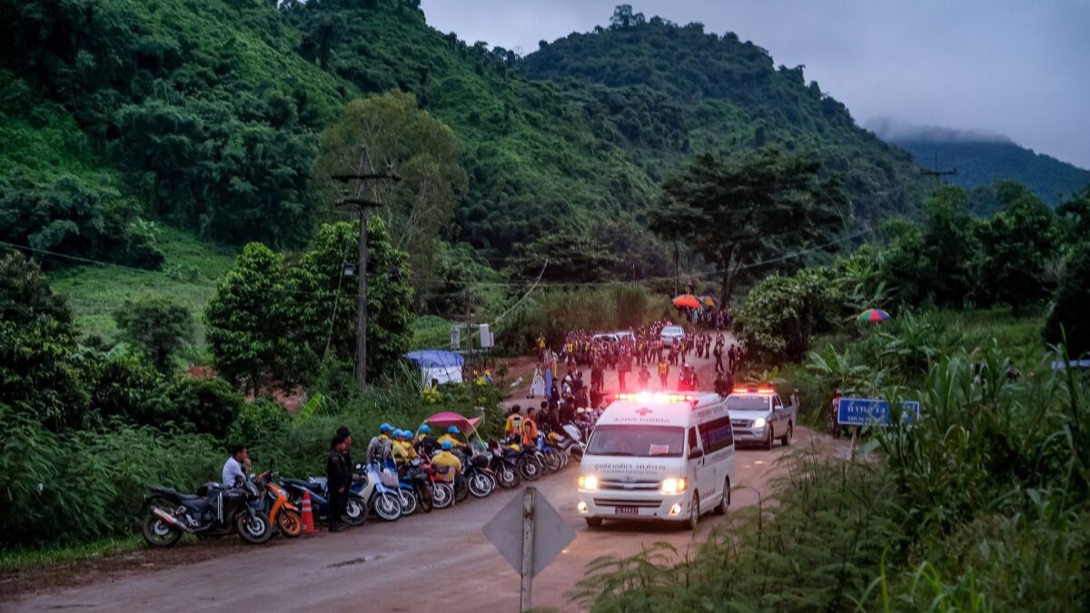 An ambulance carrying one of the boys rescued from the cave in northern Thailand heads toward a hospital in Chiang Rai.