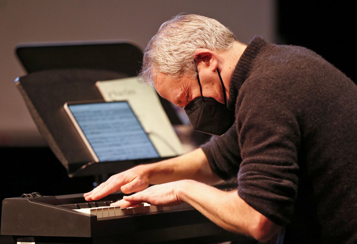 Pianist Jeremy Denk plays a dramatic piece of classical music during the assembly.