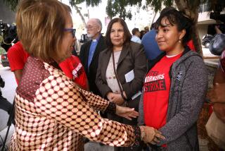 SANTA MONICA, CA - OCTOBER 23, 2023 - State Senator Maria Elena Durazo, left, confers with Norelis Vargas, right, from Venezuela, along with Angelica Salas, center, Executive Director of CHIRLA, after a press conference to address the allegation that refugee workers are using a dodgy agency to provide houseless strikebreakers to work at Le Meridien Defina hotel in Santa Monica on October 23, 2023. Vargas was hired as a temporary worker at the Four Points Hotel near LAX and currently lives at the Union Rescue Mission. (Genaro Molina / Los Angeles Times)