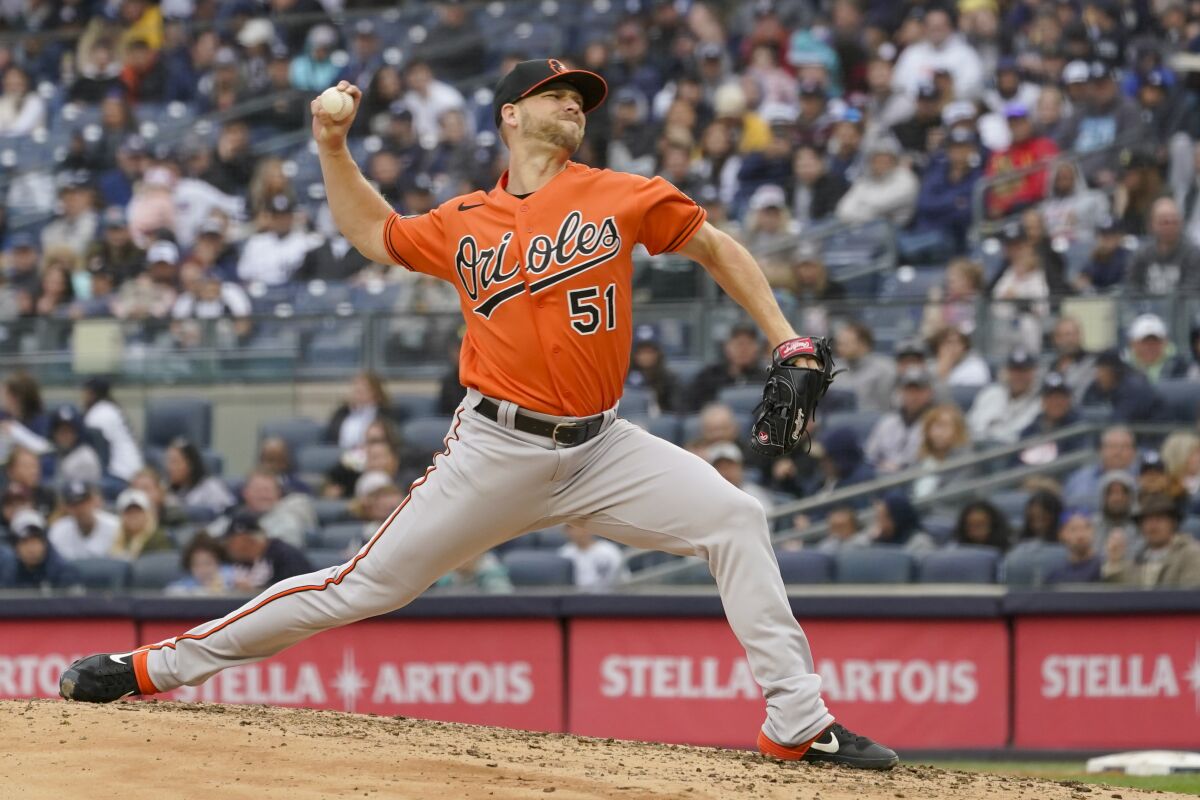 FILE - Baltimore Orioles pitcher Austin Voth delivers against the New York Yankees in the third inning of a baseball game on Oct. 1, 2022, in New York. Voth avoided a salary arbitration hearing with the Orioles, agreeing Thursday, Jan. 26, 2023, to a $1.85 million, one-year contract. (AP Photo/Mary Altaffer, File)