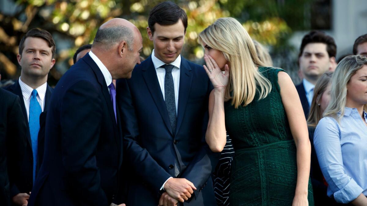 White House chief economic adviser Gary Cohn, left, White House senior adviser Jared Kushner, center, and Ivanka Trump speak on the South Lawn of the White House in Washington on Sept. 11.