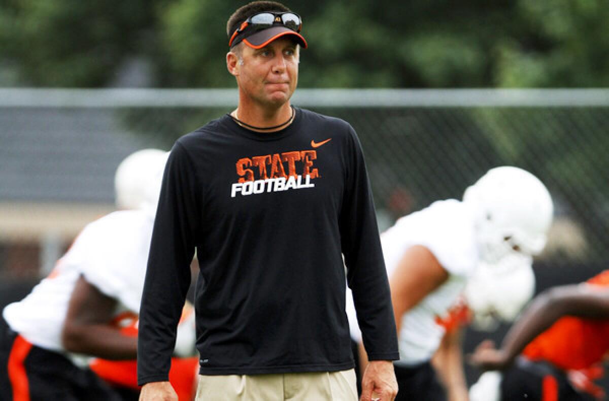 Oklahoma State Coach Mike Gundy and his Cowboys, coming off an 8-5 season, are the Big 12 Conference favorites.