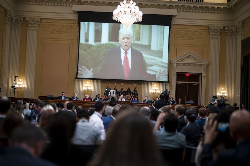 WASHINGTON, DC - JULY 21: Footage of former President Donald Trump filming a video to tell the insurrectionist mob to leave the U.S. Capitol is seen on screen during a hearing of the House Select Committee to Investigate the January 6th Attack on the United States Capitol in the Cannon House Office Building on Thursday, July 21, 2022 in Washington, DC. The bipartisan Select Committee to Investigate the January 6th Attack On the United States Capitol has spent nearly a year conducting more than 1,000 interviews, reviewed more than 140,000 documents day of the attack. (Kent Nishimura / Los Angeles Times)