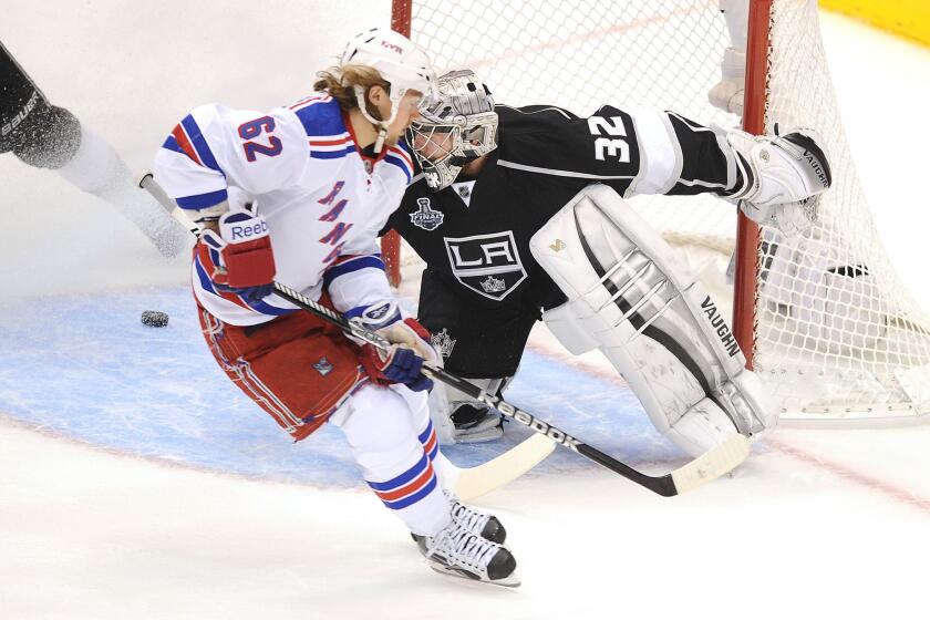 New York Rangers forward Carl Hagelin scores a short-handed goal on Kings goalie Jonathan Quick during Game 1 of the Stanley Cup Final in 2014.