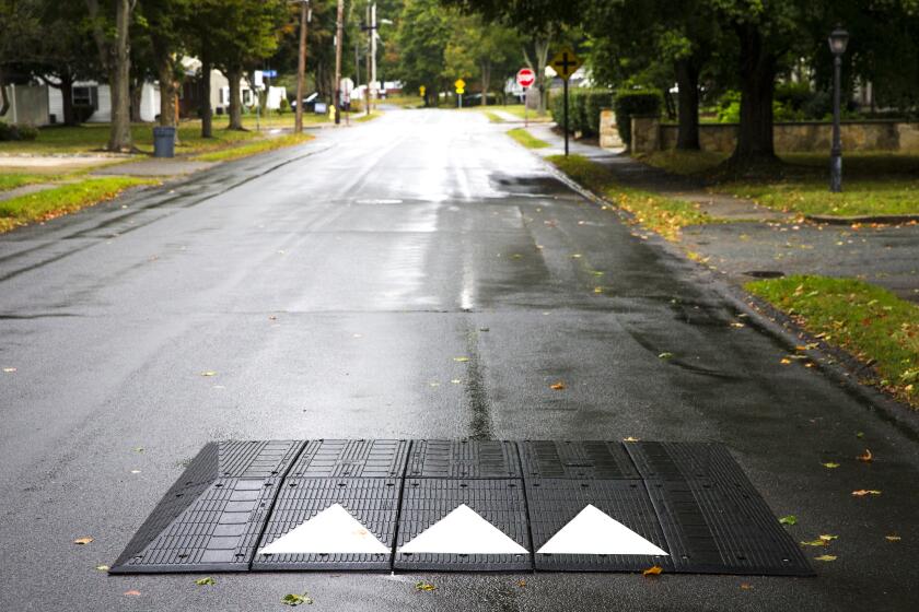 BRAINTREE, MA - SEPTEMBER 12: A speed bump is pictured along Addison Street in Braintree, MA on Sep. 12, 2019. Concerned about the growing number of cars invading quiet residential streets to escape congestion on major roads - a trend officials attribute in part to the growing popularity of traffic apps - many cities and towns are grappling with ways to curb the cut-throughs. (Photo by Nic Antaya for The Boston Globe via Getty Images)