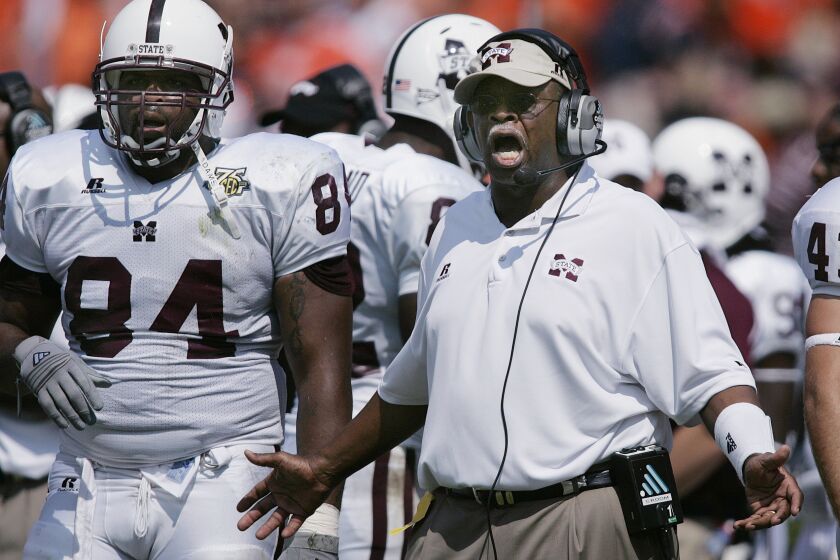 FILE - Mississippi State coach Sylvester Croom yells to the team near the end of a 19-14 win over Auburn in an NCAA college football game at Jordan-Hare Stadium in Auburn, Ala., Sept. 15, 2007. Croom had a Hall of Fame career as an offensive lineman at Alabama, and was among the first Black players to become a star and team leader under coach Bear Bryant. Three decades later, Croom became the Southeastern Conference's first Black head football coach with Mississippi State. That was 2004. Since then, there have only been four others and currently there are no Black head football coaches in the SEC. (AP Photo/Dave Martin, File)