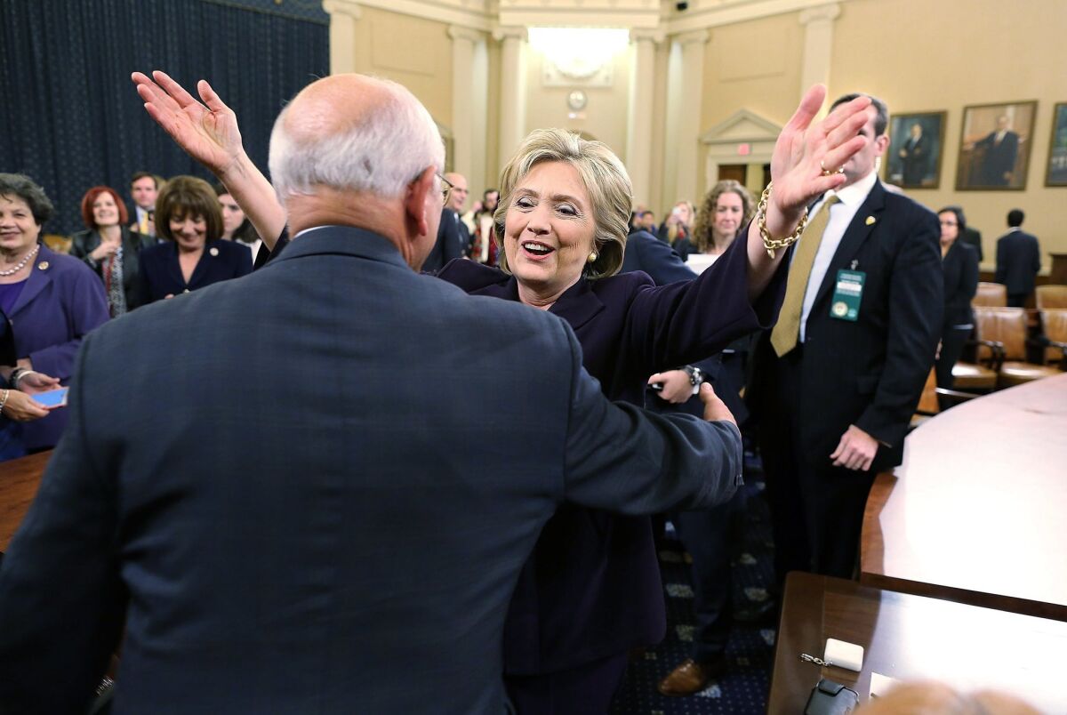 WASHINGTON, DC - OCTOBER 22: Democratic presidential candidate and former Secretary of State Hillary Clinton greets a man during a break of a hearing before the House Select Committee on Benghazi October 22, 2015 on Capitol Hill in Washington, DC. The committee held a hearing to continue its investigation on the attack that killed Ambassador Chris Stevens and three other Americans at the diplomatic compound in Benghazi, Libya, on the evening of September 11, 2012. (Photo by Chip Somodevilla/Getty Images) ** OUTS - ELSENT, FPG, CM - OUTS * NM, PH, VA if sourced by CT, LA or MoD **