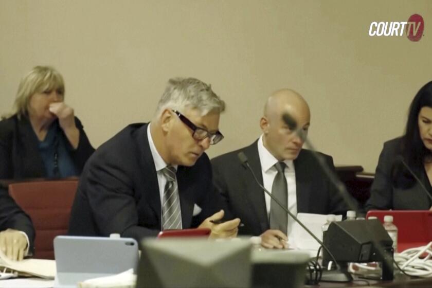 In this image taken from pool video, actor Alec Baldwin, left, appears for a pretrial hearing Monday, July 8, 2024, in Santa Fe, N.M. The actor's involuntary manslaughter trial starts July 9 with jury selection. (Court TV via AP, Pool)