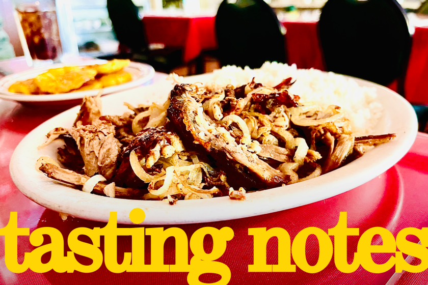 Pierna de puerco with a side of tostones at the Cuban restaurant El Colmao in Los Angeles.