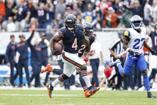 The Bears' D'Andre Swift (4) runs 36 yards for a touchdown against the Rams.