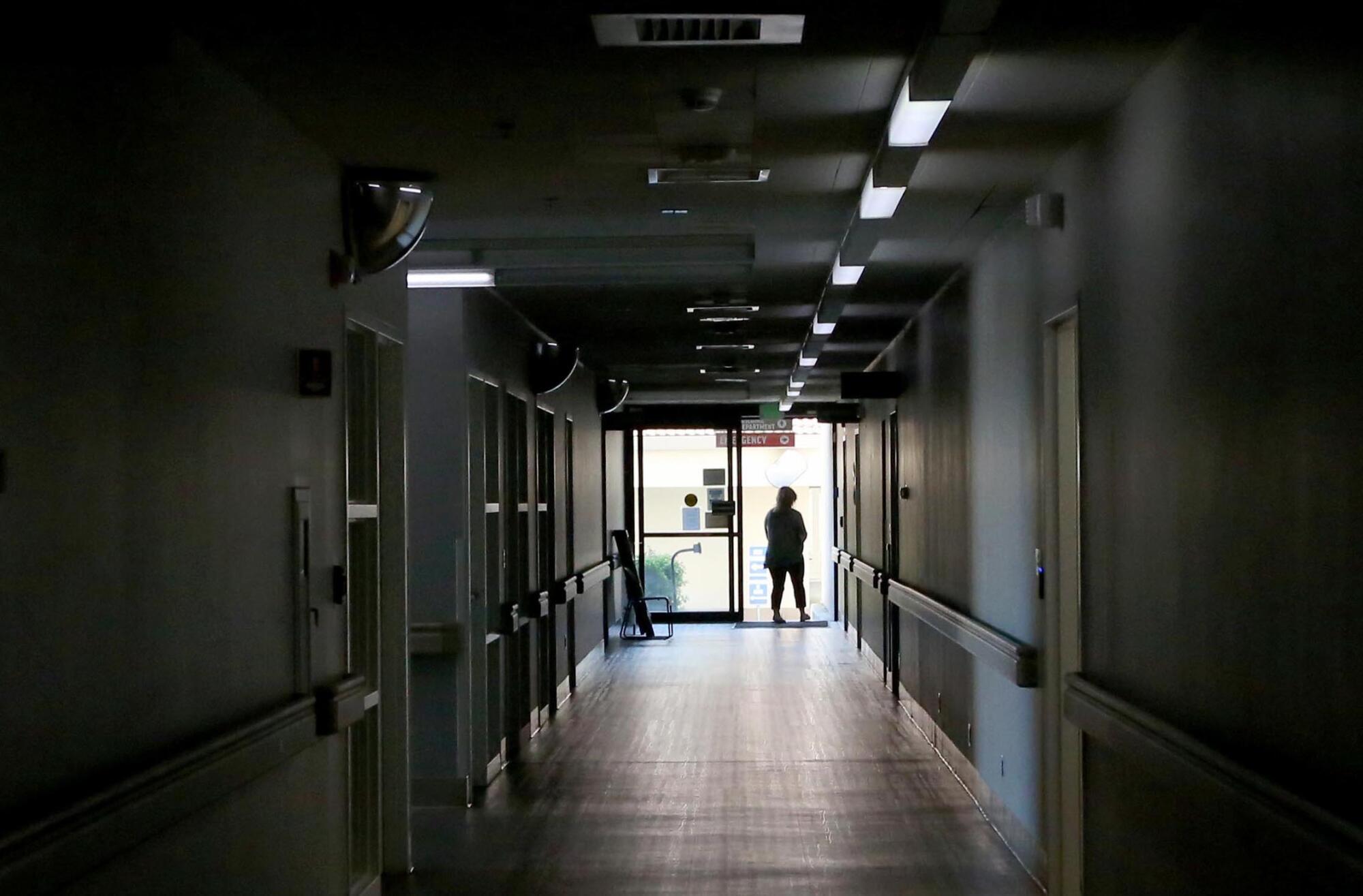 A member of the information technology unit exits Madera Community Hospital.