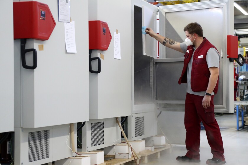 An employee of Binder checks an ultra-low temperature freezer in Tuttlingen, Germany.