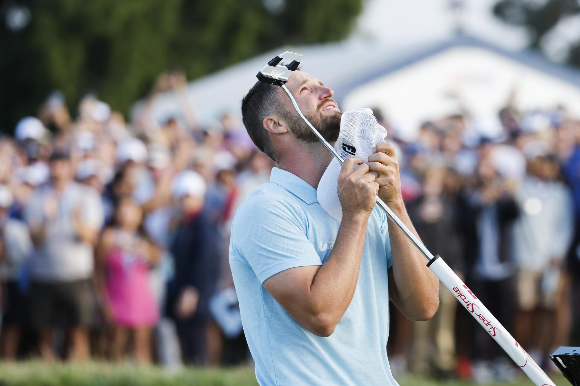 Wyndham Clark celebrates on the 18th green after winning the U.S. Open at Los Angeles Country Club.