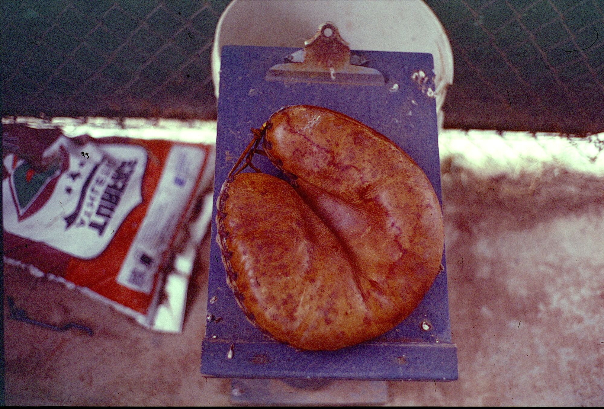 A Lordsburg Trolleyman catchers mitt in the dugout during a game against the Perris Prospectors.