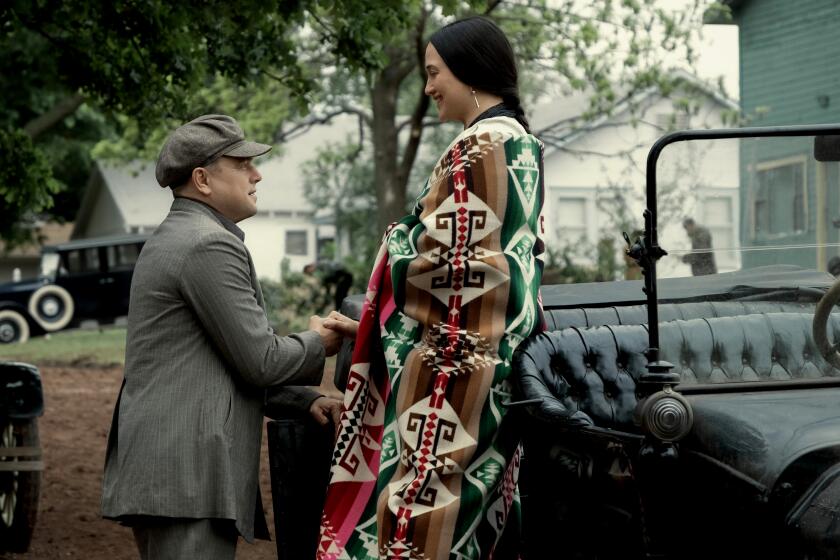 Leonardo DiCaprio and Lily Gladstone in "Killers of the Flower Moon," premiering in theaters around the world on October 20, 2023.