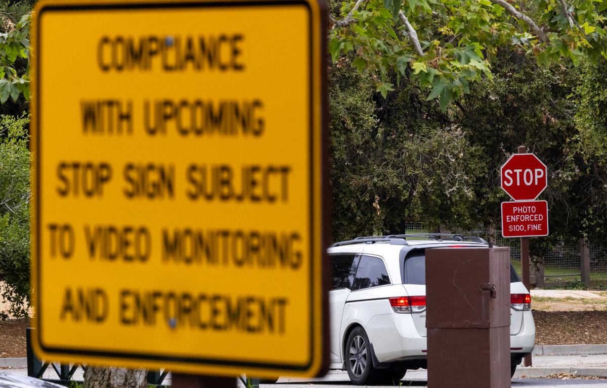 Stop signs and warnings to not violate them or face a $100 fine in Temescal Gateway Park in Pacific Palisades.