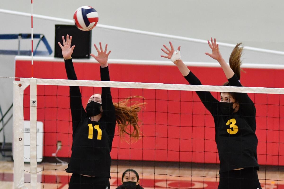 Brooklyn Burns and Claire Deller work the net.