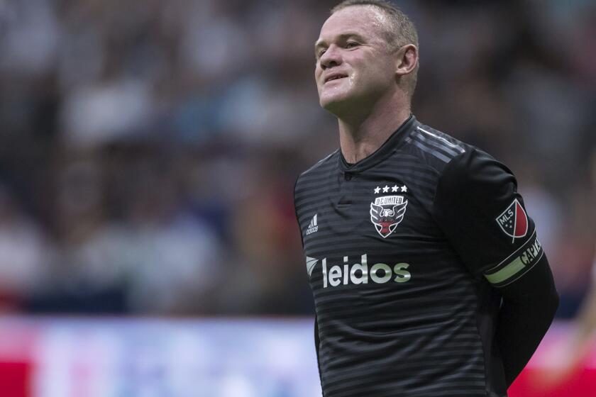 D.C. United's Wayne Rooney reacts after putting a shot over top of the Vancouver Whitecaps' goal during the first half of an MLS soccer match Saturday, Aug. 17, 2019, in Vancouver, British Columbia. (Darryl Dyck/The Canadian Press via AP)