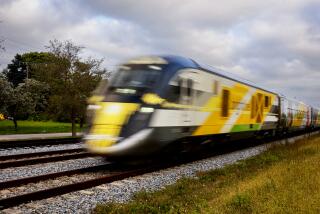 A Brightline train passes through the Miami Design District on its way to Brightline Miami Station in Miami, Florida, US, on Tuesday, February 6, 2024. (Eva Marie Uzcategui / Los Angeles Times)