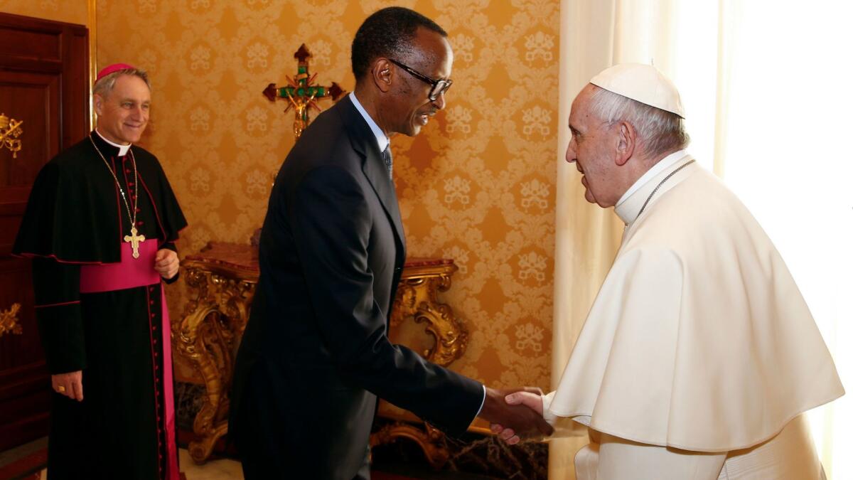 Pope Francis welcomes Rwanda's President Paul Kagame during a private audience at the Vatican on March 20.