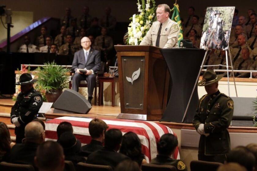 LANCASTER, CALIF. -- THURSDAY, OCTOBER 13, 2016: Los Angeles County Sheriff Jim McDonnell speaks as thousands of law enforcement officials and members of the community gathered for the funeral of slain Los Angeles County Sheriff's Sgt. Steve Owen at Lancaster Baptist Church October 13, 2016 in Lancaster. (Irfan Khan / Los Angeles Times)