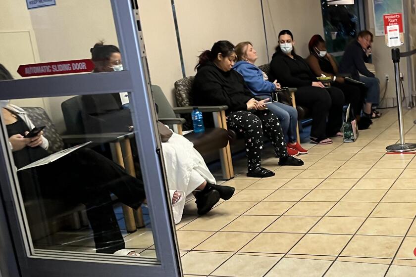 FRESNO, CA - MAY 9, 2023 - Patients fill out a row of chairs while waiting to be seen at the emergency room at Saint Agnes Medical Center in Fresno, California, on May 9, 2023. Chief Medical Officer for Madera County, says that a lot of the trauma cases from Madera now have to receive treatment at a hospital in Fresno. "I've never seen the ER that busy. It is unbelievable there," said Dr. Simon about the current influx of patients from Madera being treated at the Community Regional Medical Center in Fresno. The community of Madera has been without a hospital since its closure. The Madera Community Hospital has been closed since January 3 after experiencing financial strains and filing for Chapter 11 bankruptcy. (Genaro Molina / Los Angeles Times)