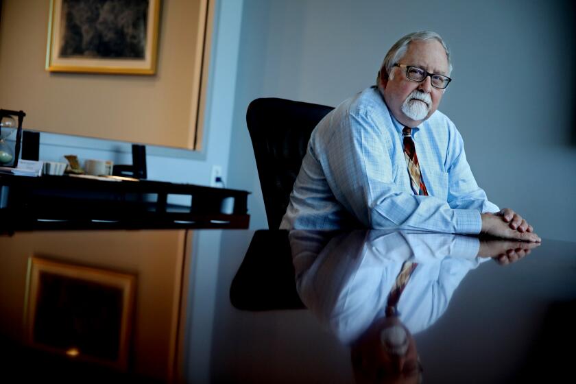 VALENCIA, CA - SEPTEMBER 21: Mark Young, 67, attorney with Donahoe Young and Williams, at his office on Wednesday, Sept. 21, 2022 in Valencia, CA. Young was one of the two intended targets in a murder for hire plot by Arthur Aslanian, 53, of La Canada Flintridge. Aslanian has been arrested on a federal criminal complaint alleging he attempted to arrange the killings of a attorney Mark Young and a real estate banker to which he owed hundreds of thousands of dollars. (Gary Coronado / Los Angeles Times)