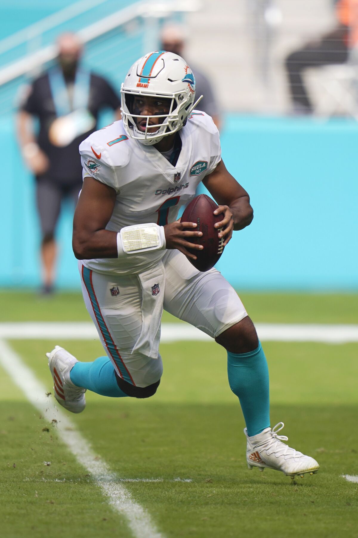 Miami Dolphins quarterback Tua Tagovailoa (1) looks to pass the ball during the first half of an NFL football game against the Los Angeles Rams, Sunday, Nov. 1, 2020, in Miami Gardens, Fla. The L.A. Chargers play at Miami on Sunday. (AP Photo/Wilfredo Lee)