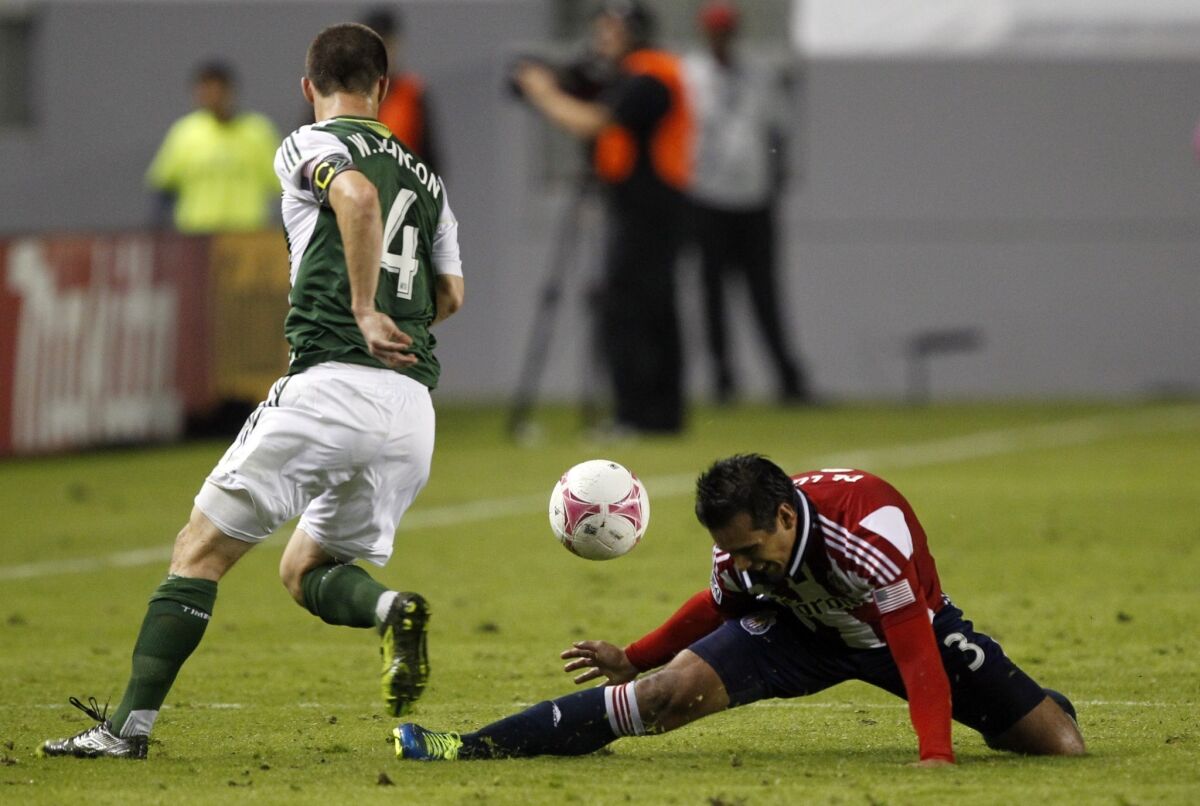 Portland Timbers midfielder Will Johnson steals the ball from Chivas USA defender Mario de Luna back in October.