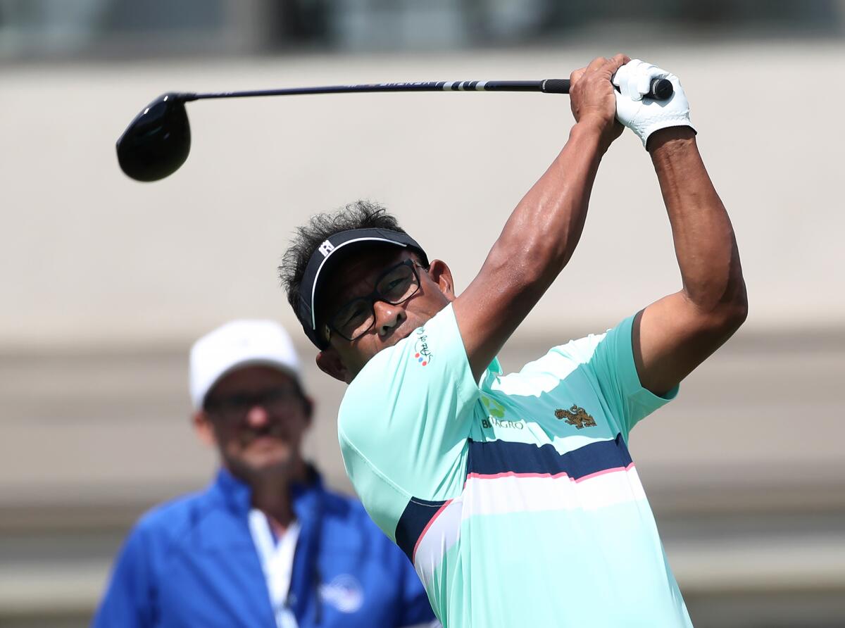 Tournament leader Thongchai Jaidee hits a long driver on No. 15 at the Hoag Classic.