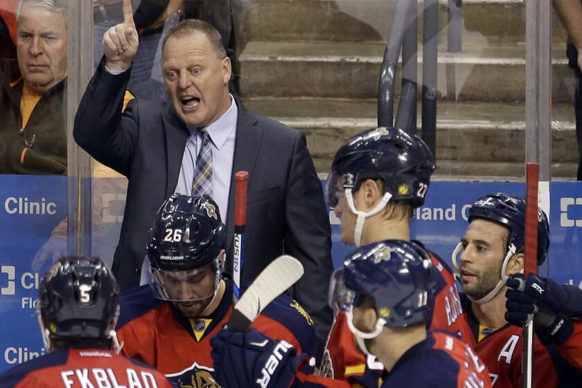 Florida Panthers Coach Gerard Gallant talks to players during a timeout in the third period of Game 1 of a first-round playoff series against the New York Islanders on April 14.