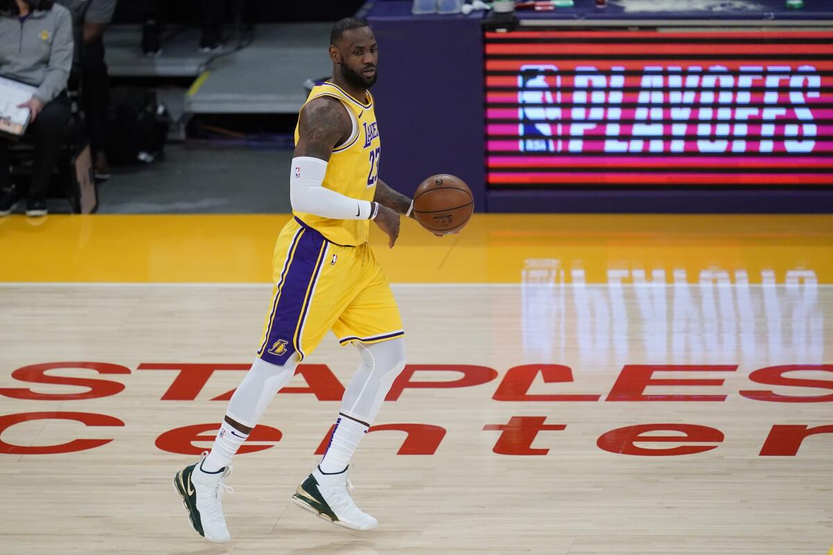 The Lakers' LeBron James handles the ball June 3 during Game 6 of the team's first-round playoff series.