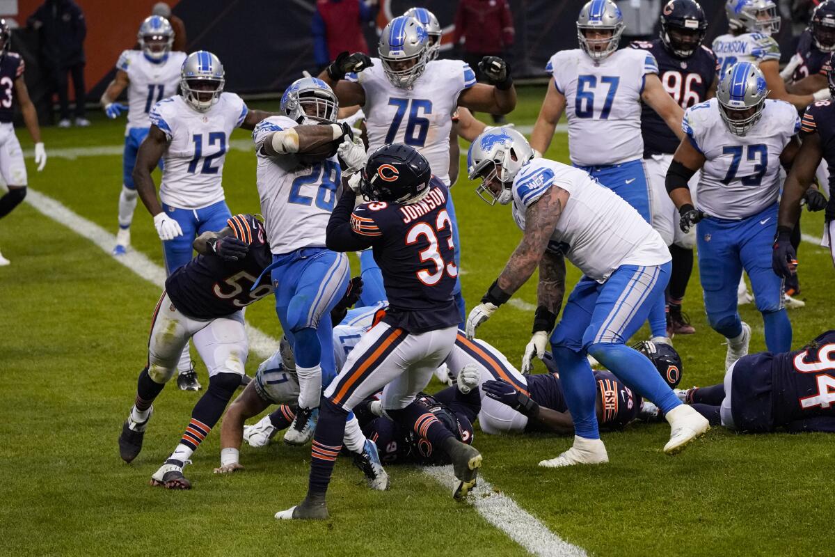 Detroit Lions running back Adrian Peterson scores a touchdown against the Chicago Bears in the fourth quarter.