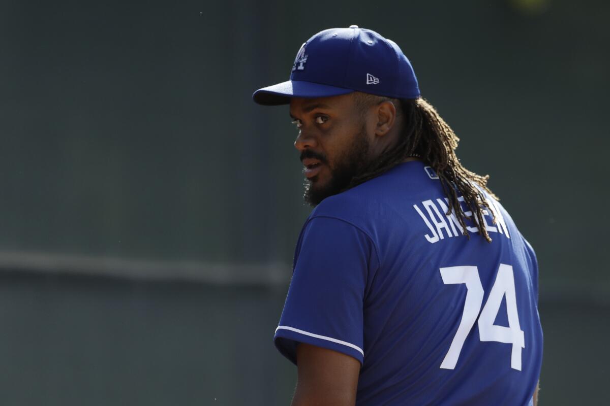 Dodgers relief pitcher Kenley Jansen looks on during spring training.