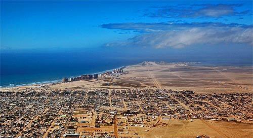 As viewed from the air, Puerto Peñasco is embraced by water, sky and a sandpaper-flat desert.